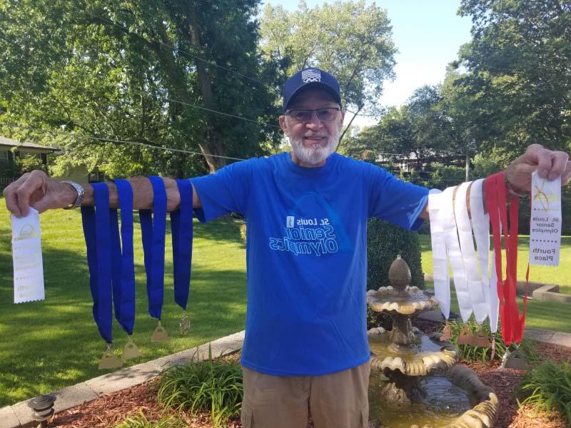 Don Young with medals he has won competing in the St. Louis Senior Olympics. (Photo courtesy of Don Young)